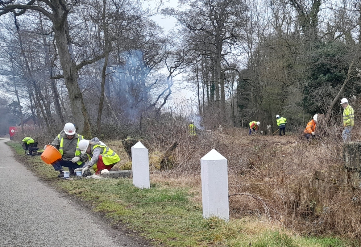 WRG North West volunteering clearing vegetation and painting posts at Carrington Lock
