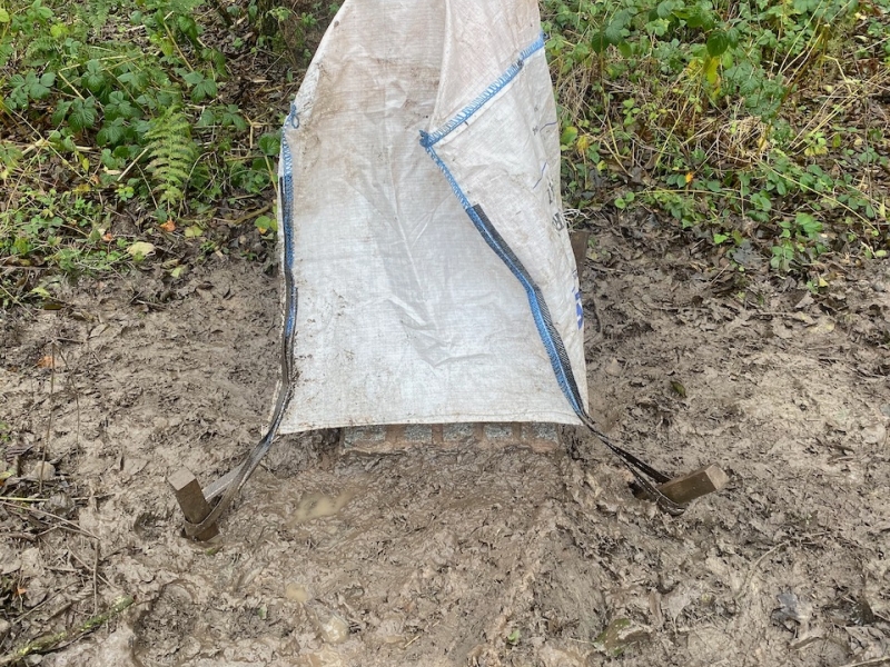 Milepost covered after plinth installation on a muddy day. Novemeber 2019